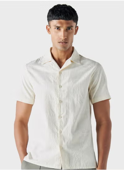 Chemise brodée coupe régulière Iconique