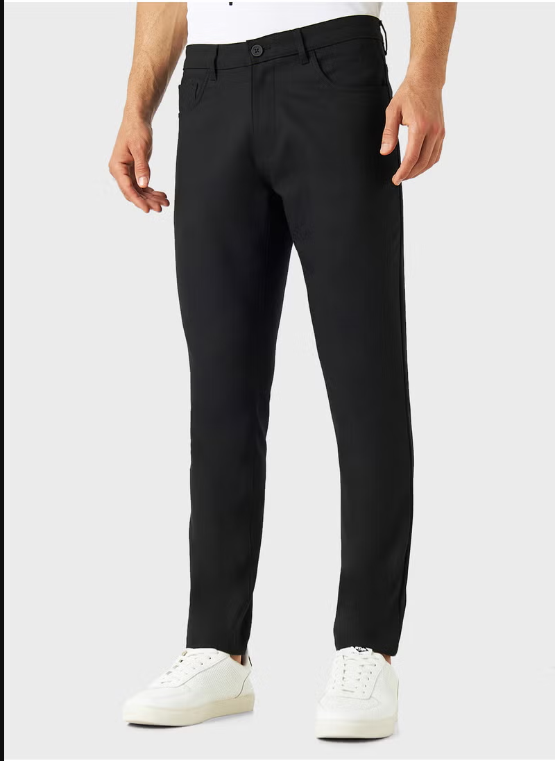 Pantalon slim emblématique uni avec poches Iconique